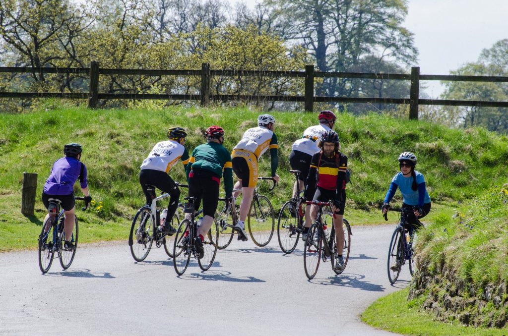 Cyclists riding in formation during a group session