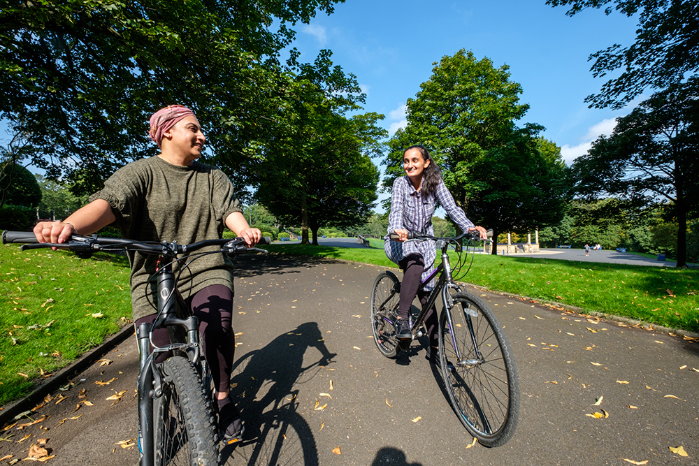 Cycling through Lister Park in Bradford